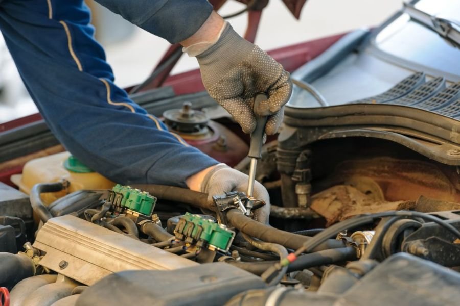 Mechanic working on fuel injectors