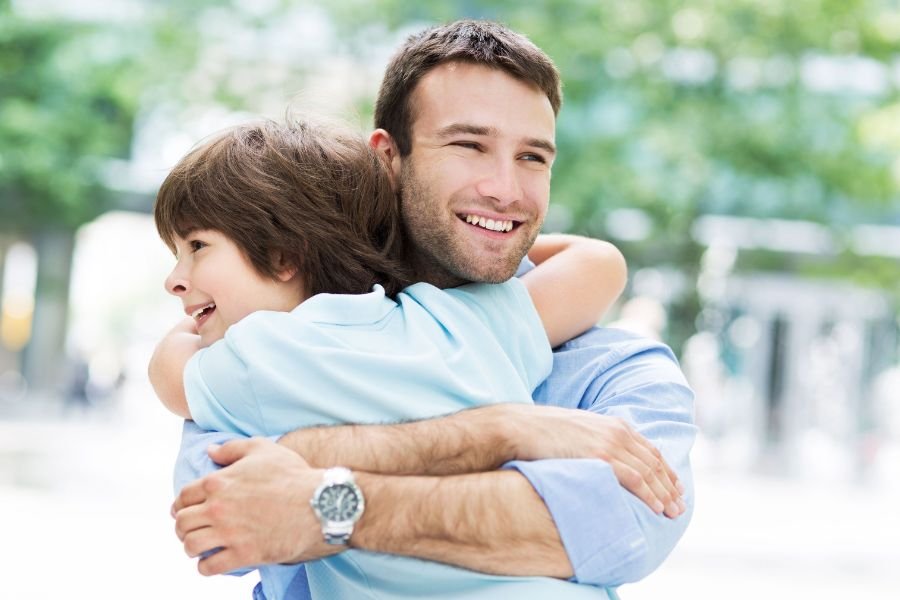 man playing with kid after getting custody